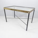 A mid-century Italian iron and brass table with glass top and cross stretcher, 116 x 70cm, height