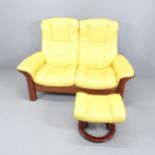 An Ekornes Stressless 2 seater Buckingham Yellow leather reclining sofa, with matching stool.