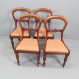 A set of four 19th century mahogany balloon back dining chairs with drop-in seats. Various repairs