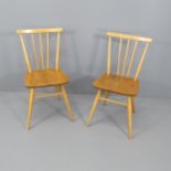 A pair of mid-century Ercol elm and beech chairs.
