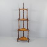 A Victorian mahogany four tier corner whatnot with inlaid decoration. Height 150cm.