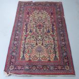 A blue and red-ground Persian prayer rug. 216x130cm