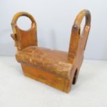 A vintage oak pommel horse, with label for Olympic Gymnasium. 48x49x25cm