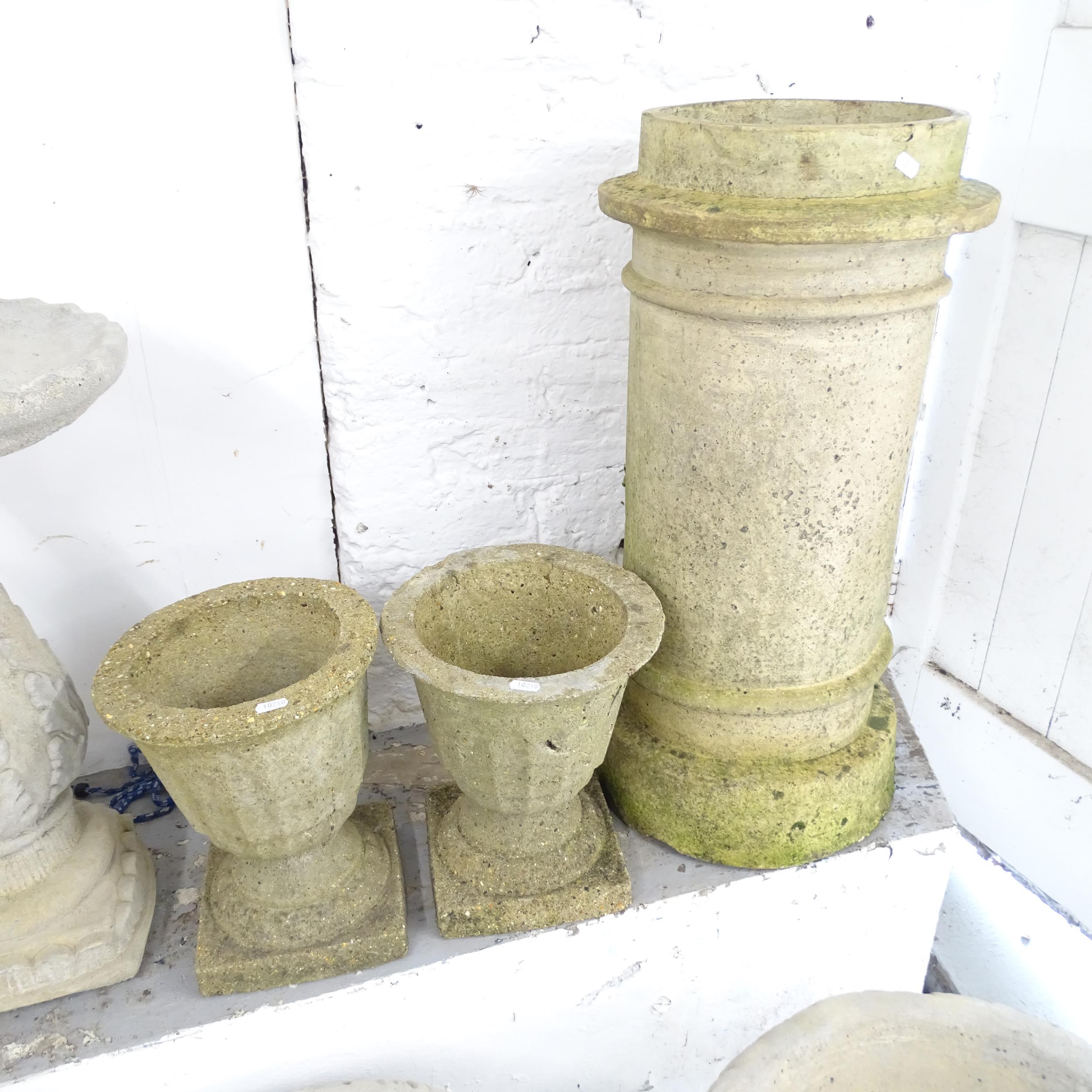 A chimney pot, height 74cn, and a pair of concrete urns 27x31cm (3)