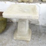A two-section concrete square-top bird bath with rose decoration. 40x50cm