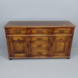 A reproduction panelled oak sideboard. 152x85x49cm