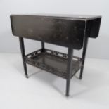An early 20th century ebonised drop-leaf table, with galleried under-tier. 71x67x36cm (extending