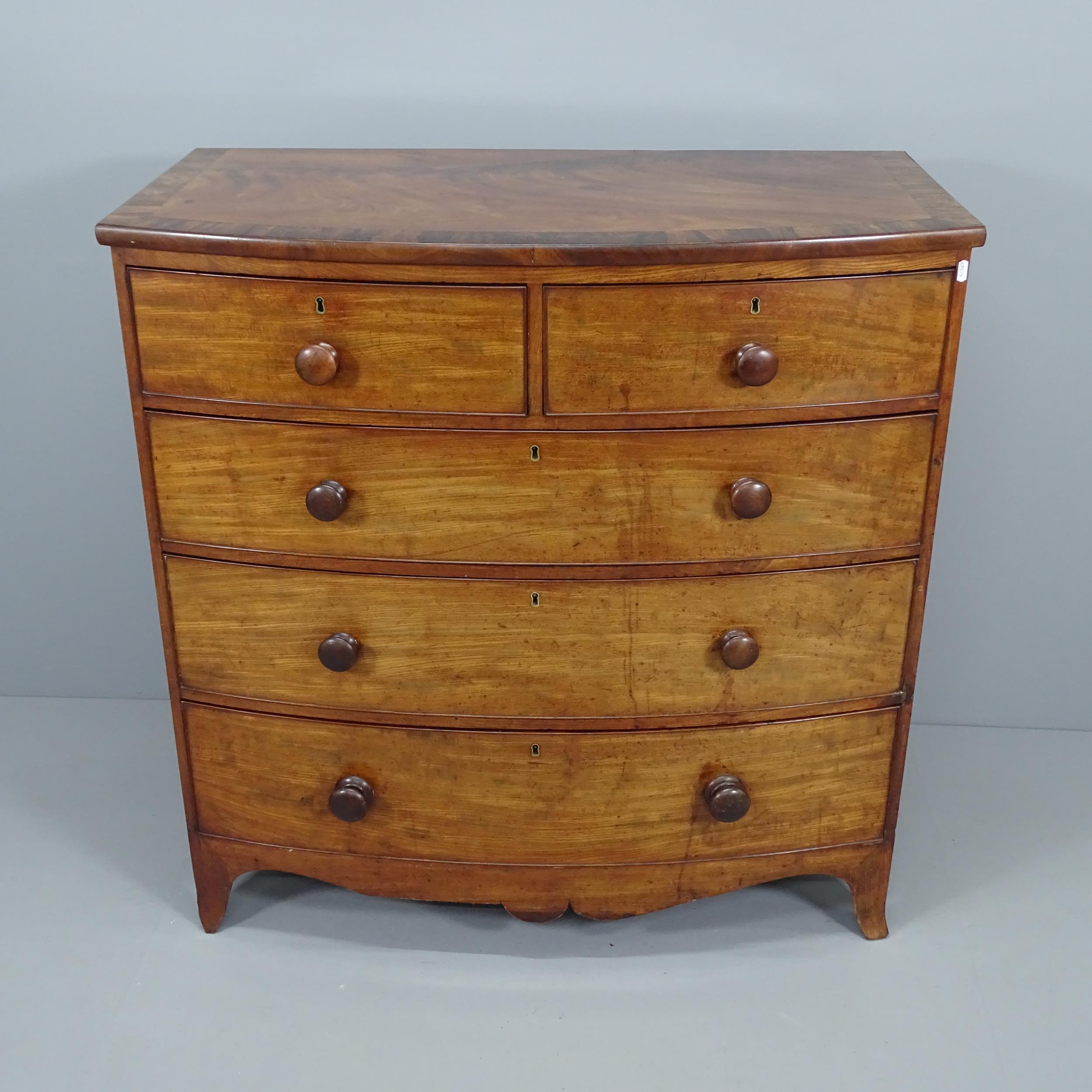 A Georgian crossbanded mahogany bow-front chest of two short and three long drawers. 106x107x56cm.
