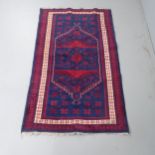 A red and blue-ground Turkish rug. 200x113