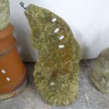 A weathered concrete garden water feature in the form of a fish. Height 59cm