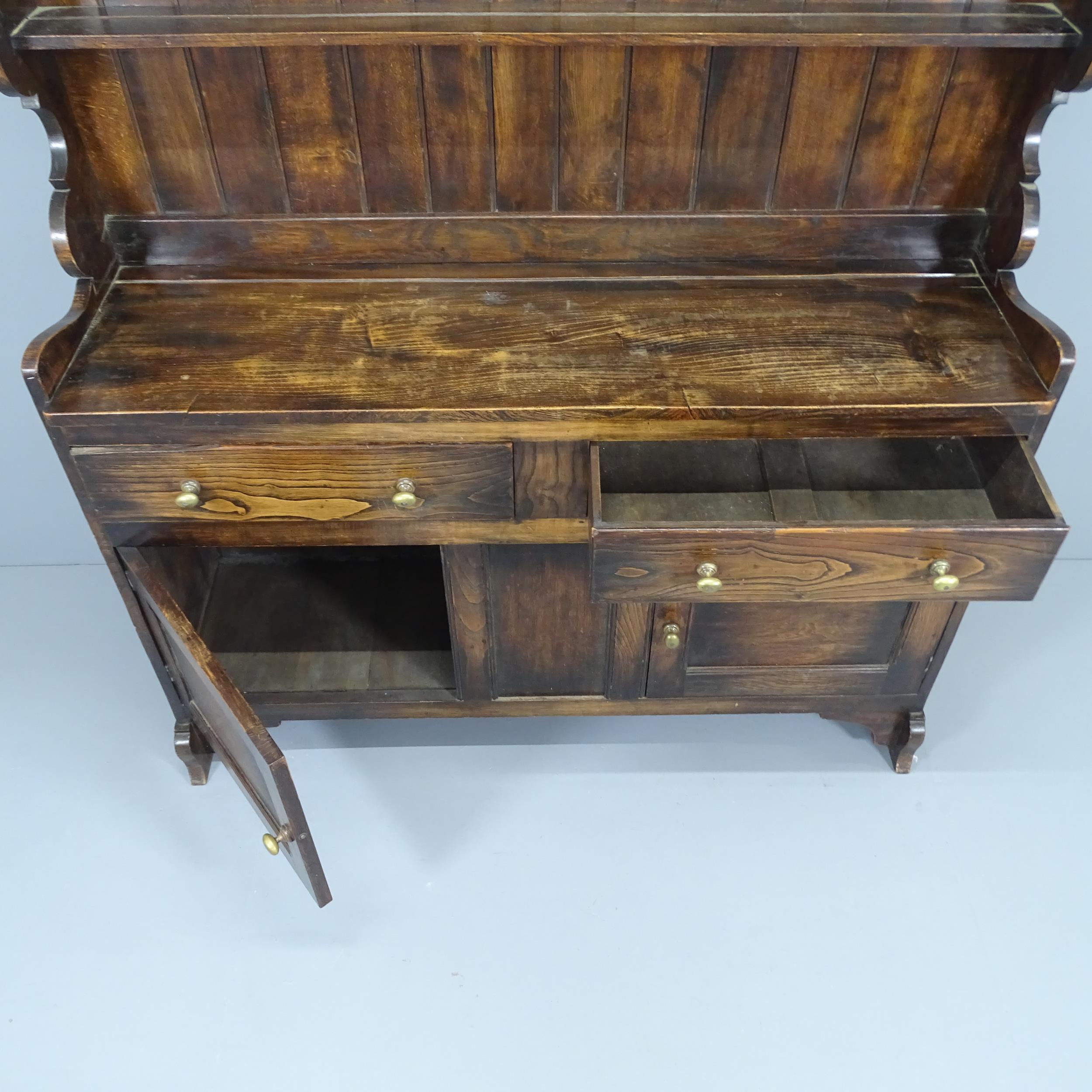 Greenings of Oxford, an oak dresser by Ambrose Heal for Heals, circa 1910. 132x156x40cm. - Image 2 of 2