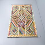 A Chobi Kilim rug. 197x121cm