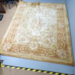 A cream-ground Aubesson carpet. 303x250cm Some areas of discolouration and low pile. Would benefit