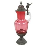 A 19th century German cranberry glass jug with metal mounts, height 14cm Good condition, some