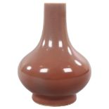 A peach glaze narrow-neck vase, with character marks to base, height 19cm