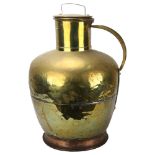 A large Dutch copper and brass flagon and cover, height 58cm