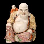 A Chinese porcelain Buddha with child on his shoulders, height 26cm No chips cracks or
