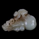 A Chinese carved jade ornament depicting a man climbing a double-gourd, length 8cm Good condition,