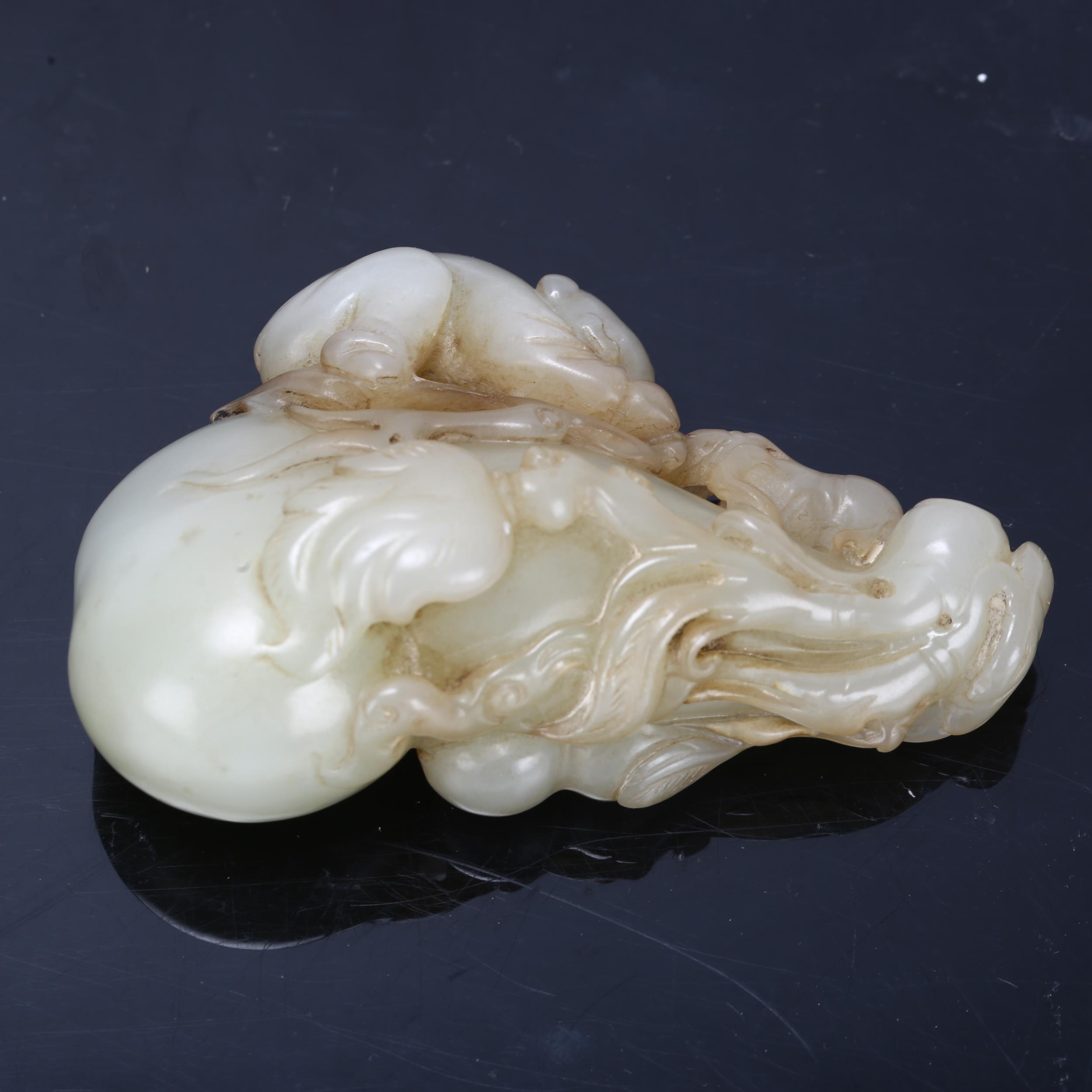A Chinese carved jade ornament depicting a man climbing a double-gourd, length 8cm Good condition, - Bild 2 aus 3