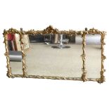 An ornate Victorian gesso-framed 3-glass over-mantel mirror, in Rococo style swept frame, overall
