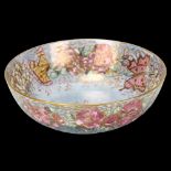 Royal Doulton lustre glaze pottery bowl, with floral surround decorated by M D McWilliam, diameter