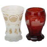 2 pieces of Bohemian glass, comprising a ruby overlay goblet with panels depicting German palaces,