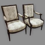 Pair of French salon armchairs, circa 1900, carved walnut show-wood surrounds and silk upholstery