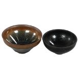 A Chinese Jian Ware style "hare's fur" tea bowl, and another black glazed tea bowl, largest diameter