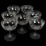 A set of 7 Antique Champagne glasses, with etched grapevine design, height 10cm