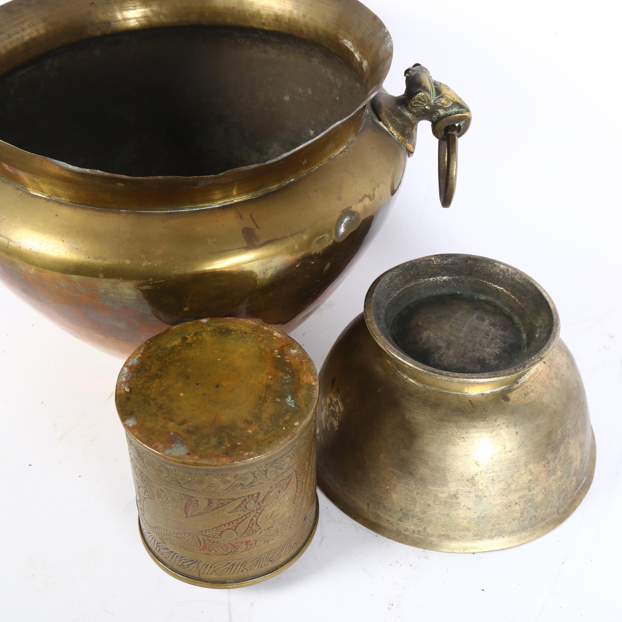 An Indian brass jardiniere with elephant ring handles, height 21cm, a footed bowl, and engraved - Image 2 of 2
