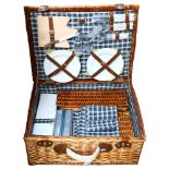 A wicker cased picnic set, as new