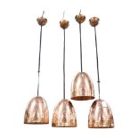 A set of 4 hammered copper ceiling pendant lights, shade height 19cm