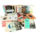 A quantity of vinyl 7" records (both loose and within sleeves), including various genres and artists