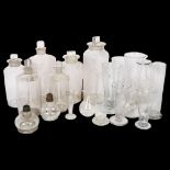 A group of Chemist's bottles and stoppers, and 8 measuring glasses etc