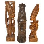 An African carved Benin head hardwood lamp base, height 40cm, and a pair of carved wood figures,