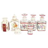 A porcelain scent bottle with floral decoration, and 2 matching jars and covers, 14cm, a Dresden jar