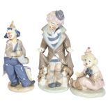 Lladro porcelain clown with puppies, 24cm, and 2 smaller NAO clowns
