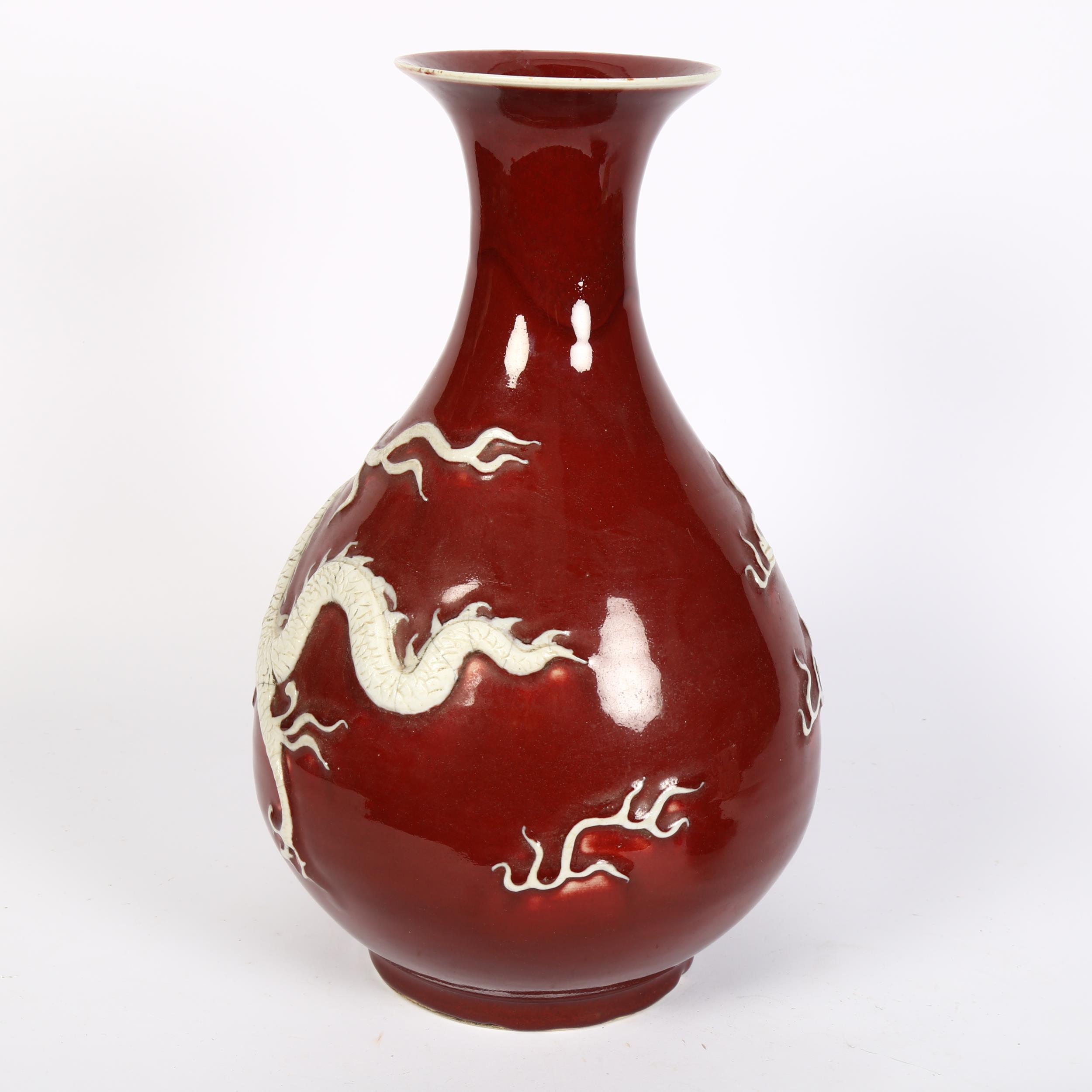 A large Chinese porcelain Sang de Boeuf 'Dragon' pear-shaped vase, Yuhuchunping, with applied dragon - Image 2 of 2