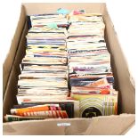 A large quantity of 7" vinyl records, mostly within sleeves, including various genres and artists