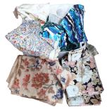 A quantity of floral cotton curtains, a throw etc