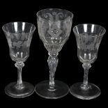 A pair of cut-glass liqueur glasses, with thumb-cut bowls on chamfered stems, with leaf and grape