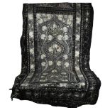 A black wool throw with embroidered floral decoration, 226cm x 110cm