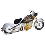 A Steam Punk wall art, a pressed metal study of a motorcycle, length 100cm