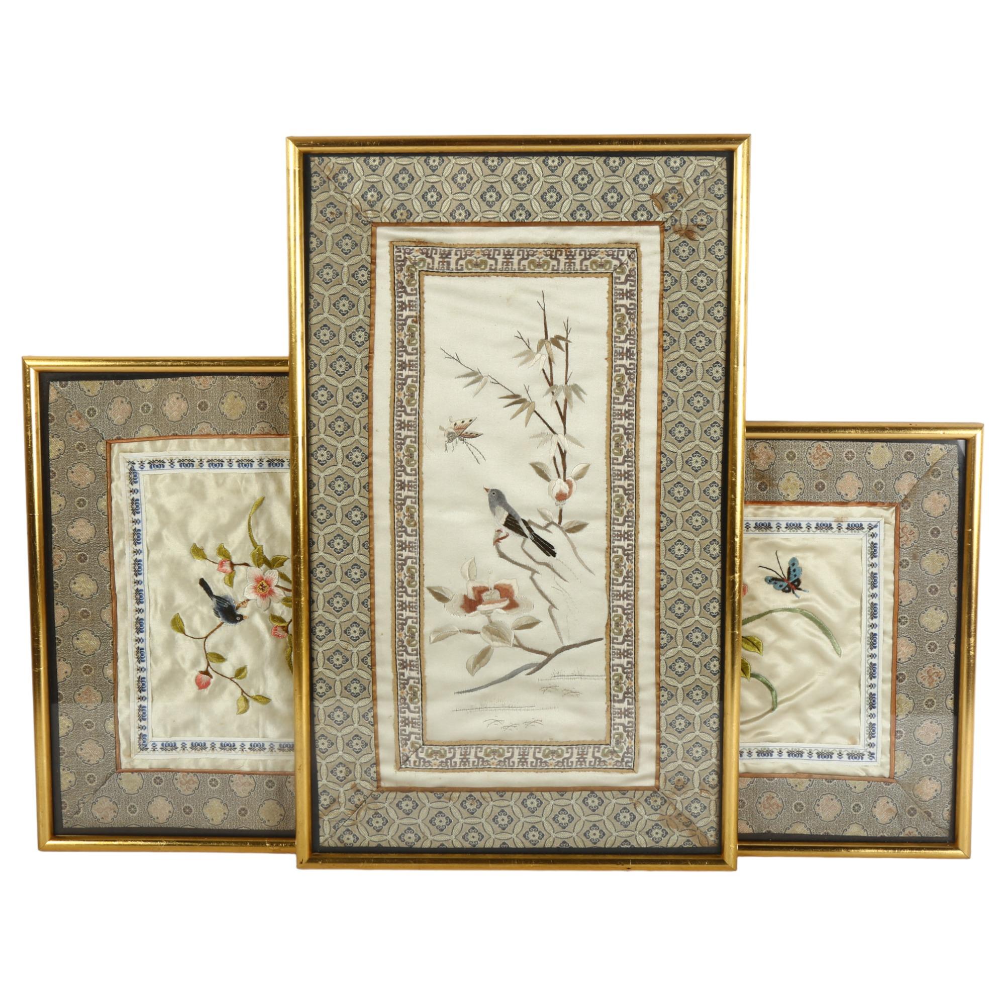 A group of 3 Chinese needlework on silk pictures, depicting birds flowers and butterfly, all framed