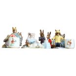 A group of Royal Doulton and Royal Albert Bunnykins and Beatrix Potter figures, and 2 egg cups