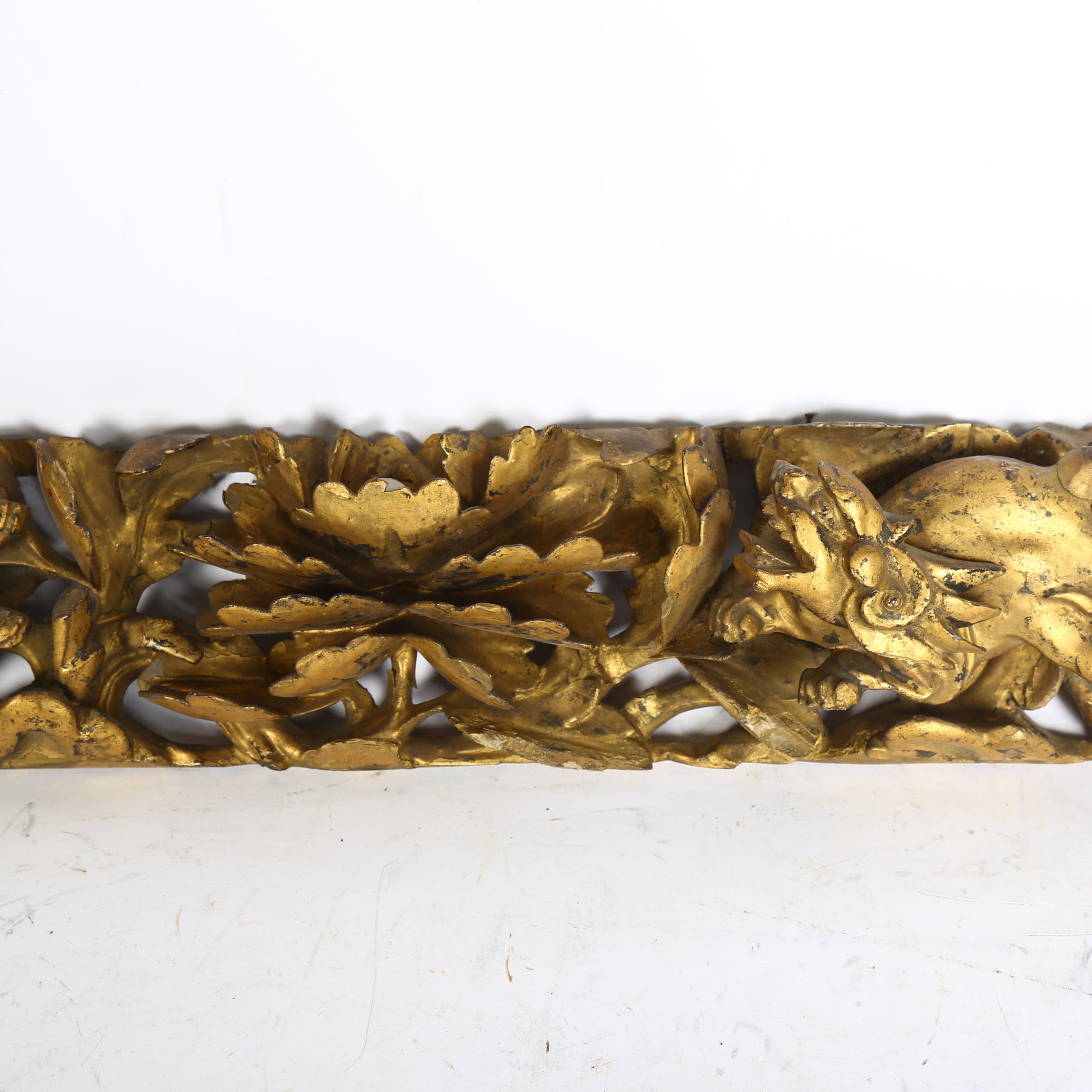 A 19th century carved gilt gesso panel of Chinese Foo Dogs and central flower, length 62cm some - Image 2 of 2