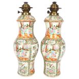 A pair of large Chinese Canton famille rose ceramic baluster oil lamps, with hand painted and