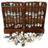 A collection of porcelain and other thimbles, and 2 spoon racks with a collection of souvenir