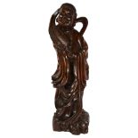 A large carved hardwood study of a Chinese figure with a quill, height 76cm