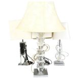 A pair of table lamps with mirrored glass columns and cream shades, height 55cm overall, a table